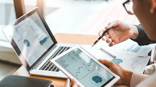 Image of a computer and a coffee mug
